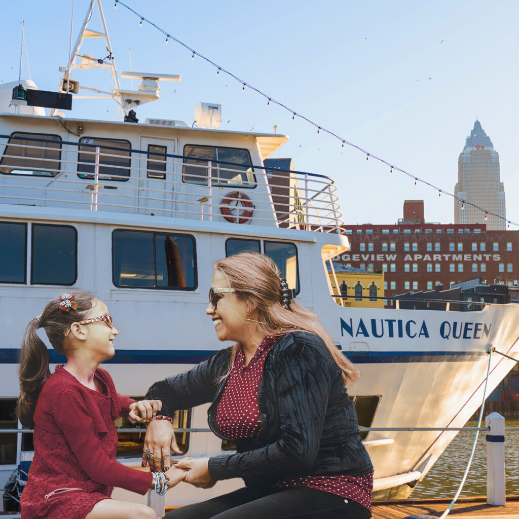 Mom and daughter sitting in front of Nautica Queen