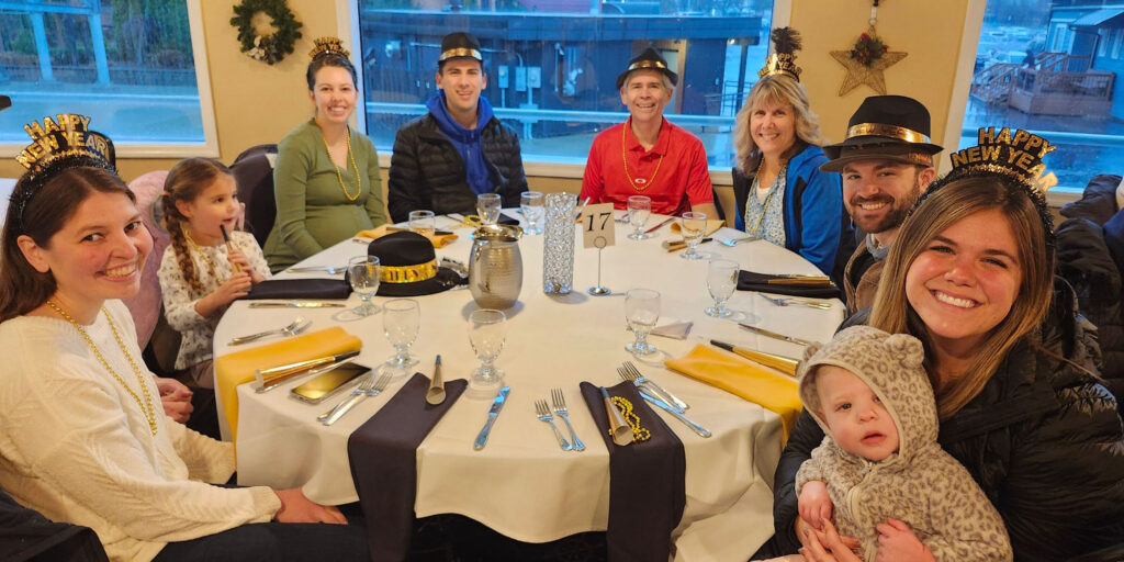 Family at table for Noon Year's Eve