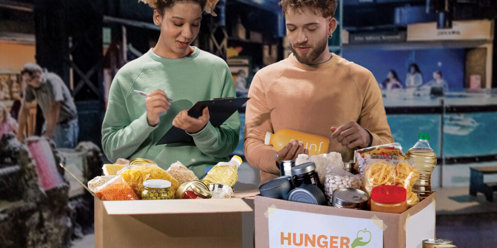 2 people checking in donations